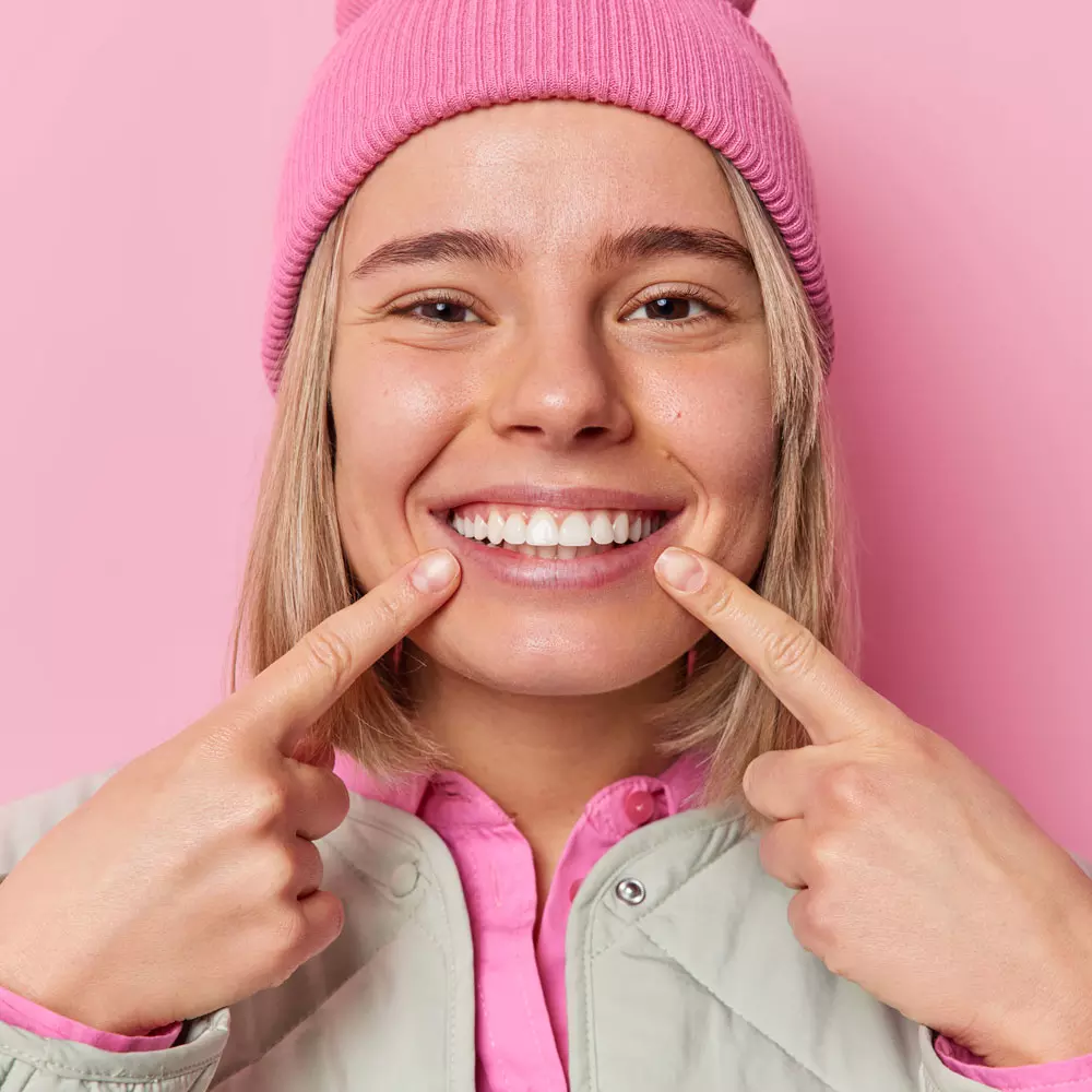cute-positive-caucasian-woman-happy-after-a-tooth-bondig-treatme